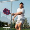 Reebok - Pickleball Set for 2 Players, Fiberglass Power Paddles with 13mm Polypropylene Core, Comfort Grip Handles, Aero Flight Balls, Ideal for Sports and Enthusiasts